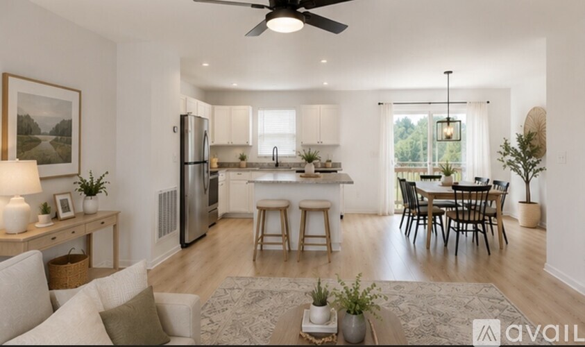 A modern kitchen with a dining table and chairs is available for rent.