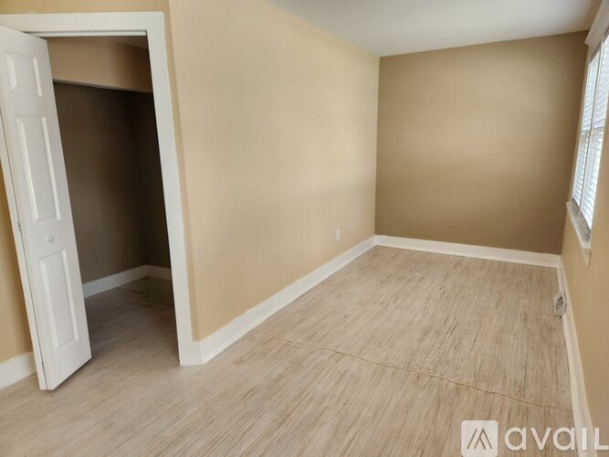 A room with a doorway leading to another room.