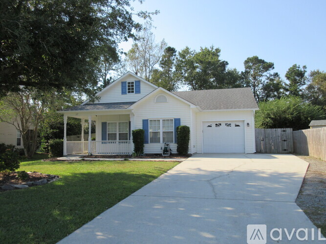 A two-story house with a white garage door.