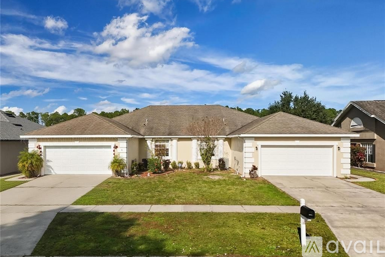 A house with a white garage door is for sale.