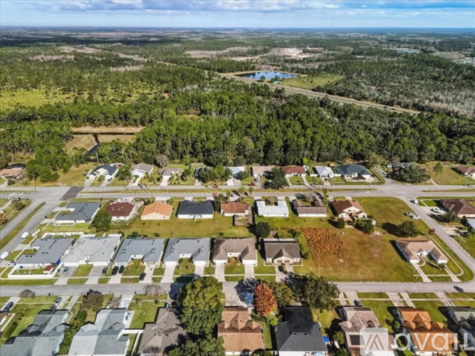 A bird's eye view of a residential area with houses and trees.