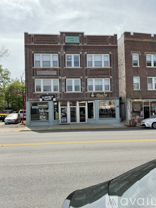 A building with a sign that says "Avail" on the front.
