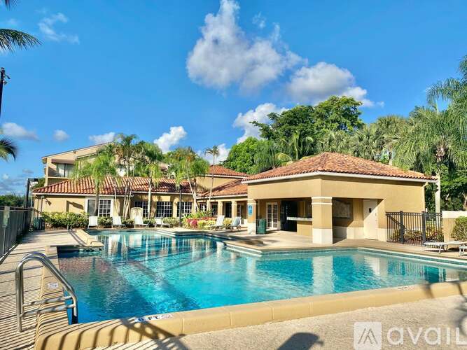 A large house with a pool in front of it.