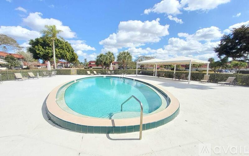 A round swimming pool with a metal ladder.