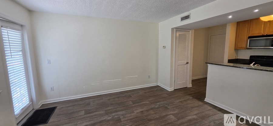 A kitchen area with a counter and cabinets.