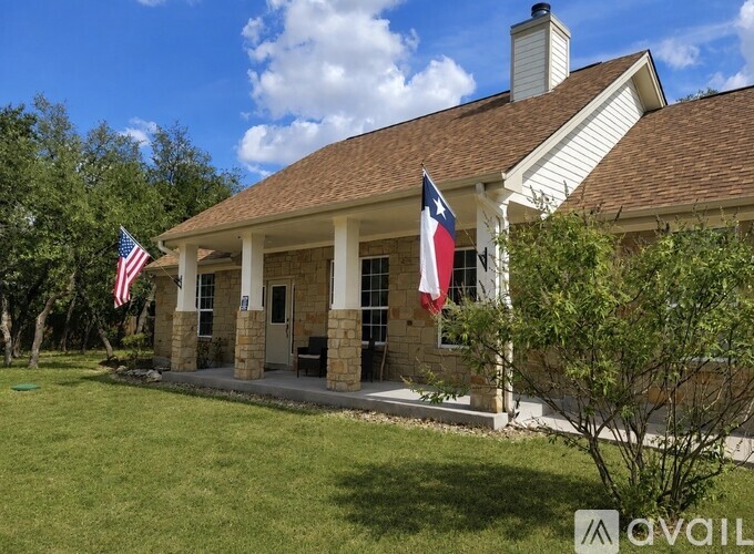 A house with a flag on the front porch.