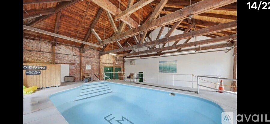 A large indoor swimming pool with the word "FIN" on the bottom.