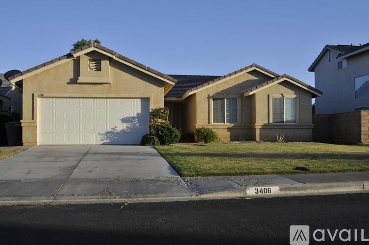 A house with the number 3406 on the front lawn.