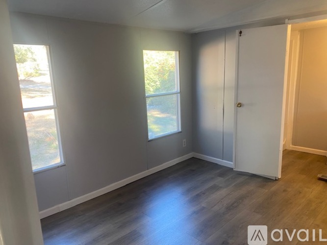A room with grey walls and a white door.
