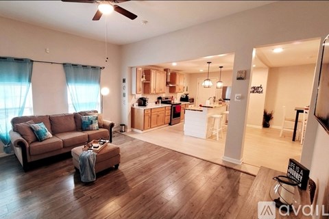 A living room with a couch and a coffee table.
