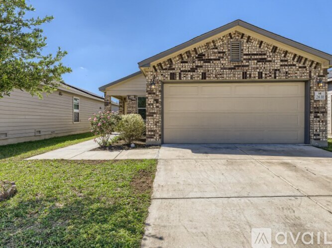 A house with a stone pillar entrance and a garage door.