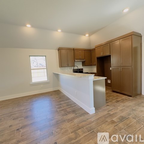 A kitchen with wooden cabinets and a white countertop.