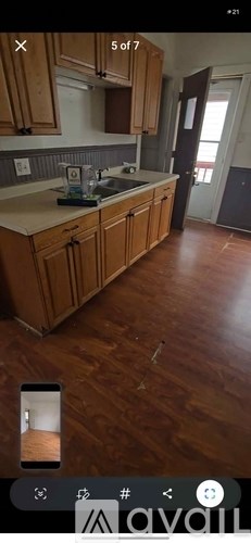 A kitchen with wooden cabinets and a countertop.