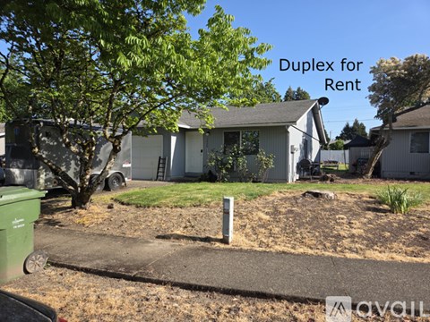 A duplex is for rent, as indicated by the sign in the image.