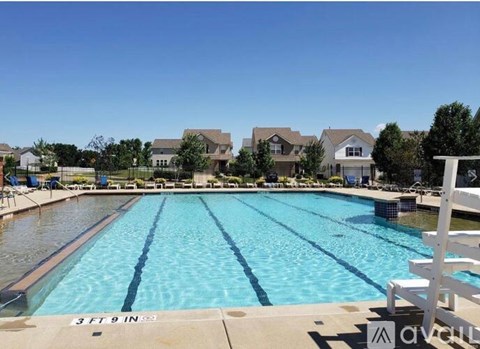 A large swimming pool with the depth marked as 3ft 9in.