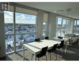 A dining room with a view of a snowy landscape outside.