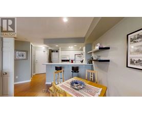 A dining room with a table set for two.