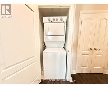 A white oven and dishwasher are built into a wall in a kitchen.
