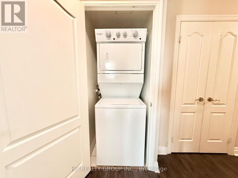 A white oven and dishwasher are built into a wall in a kitchen.