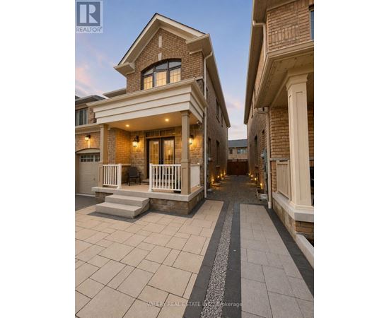 A real estate agent is showcasing a beautifully designed house with a spacious front yard.