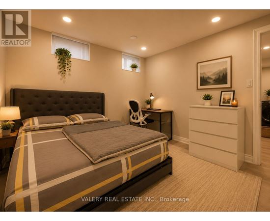 A bedroom with a bed, nightstand, and lamp.