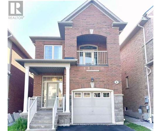 A brick house with a white garage door and a balcony.