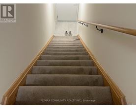 A staircase with a person walking up it.