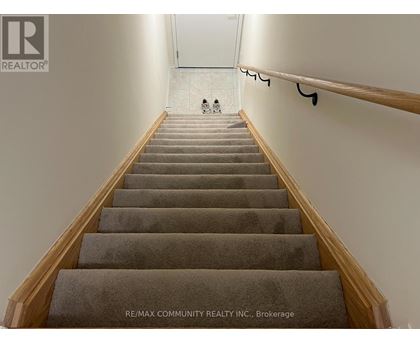 A staircase with a person walking up it.