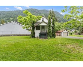 A house with a mountain in the background.