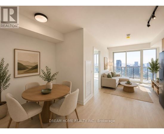 A well-lit, spacious living room with a dining table and chairs.