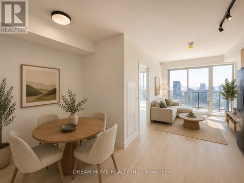 A well-lit, spacious living room with a dining table and chairs.