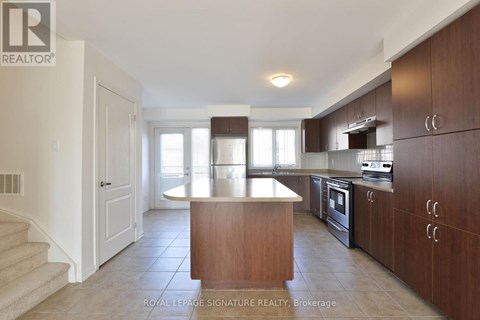 A kitchen with brown cabinets and a counter.