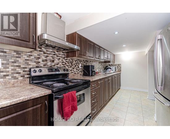 A kitchen with a stove top oven and a microwave.