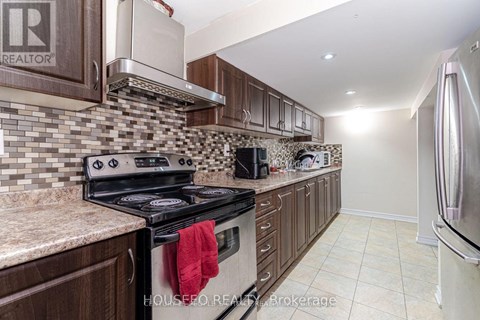 A kitchen with a stove top oven and a microwave.