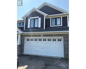 A two-story house with a white garage door.