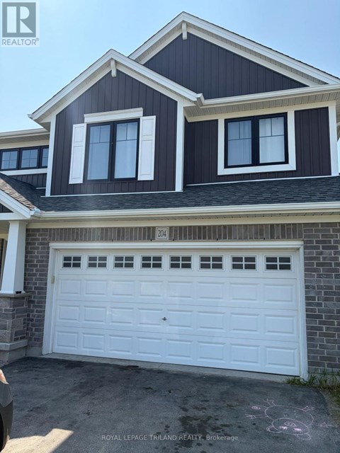 A two-story house with a white garage door.