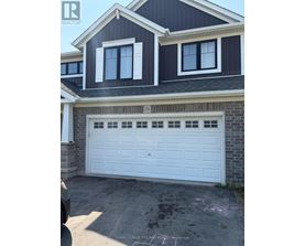 A garage with a white door and a chalk drawing on the concrete.