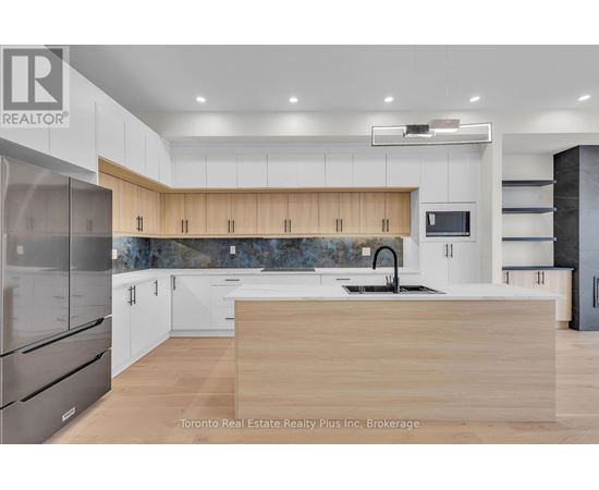 A modern kitchen with wooden countertops and stainless steel appliances.