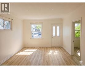 A room with wooden floors and white walls.