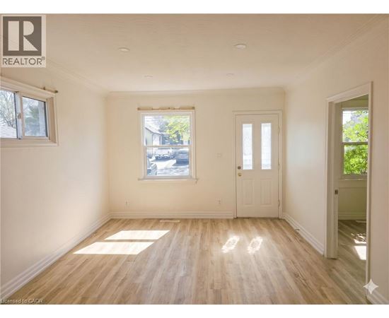 A room with wooden floors and white walls.