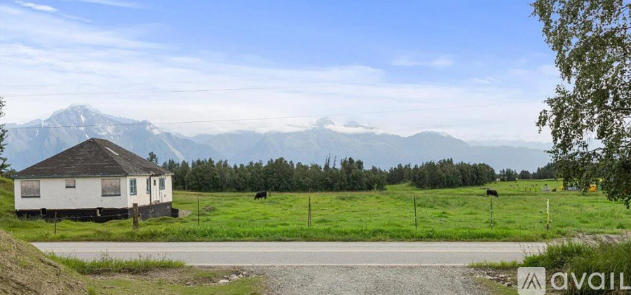 A house with a mountain in the background.