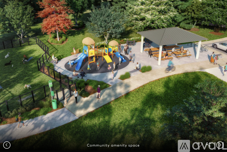 A community open space with a playground and picnic tables.