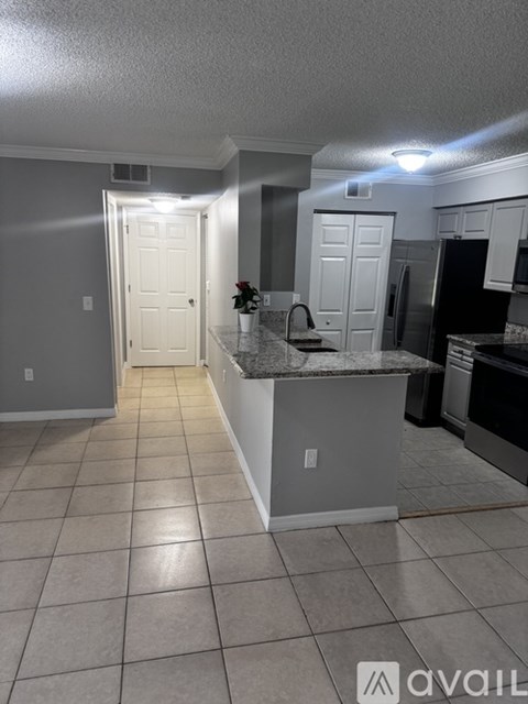 A kitchen with a counter and cabinets.
