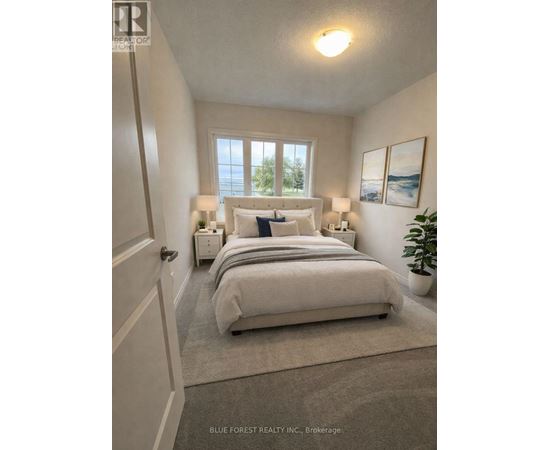 A bedroom with a large bed and two lamps.