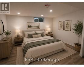 A bedroom with a large bed, nightstands, and a plant.