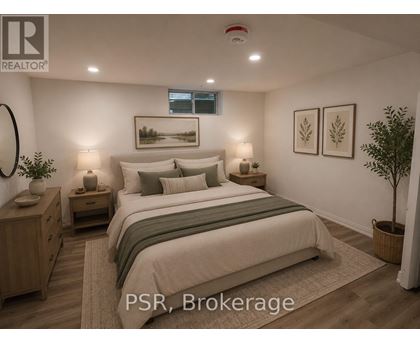 A bedroom with a large bed, nightstands, and a plant.