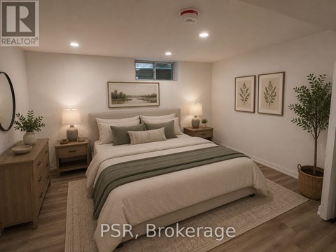 A bedroom with a large bed, nightstands, and a plant.