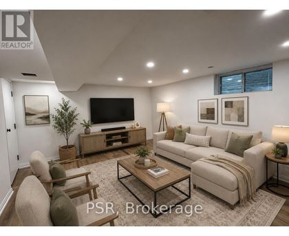A well-lit living room with a sofa, chairs, and a coffee table.