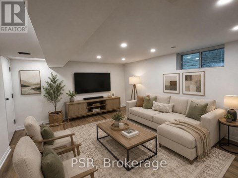 A well-lit living room with a sofa, chairs, and a coffee table.