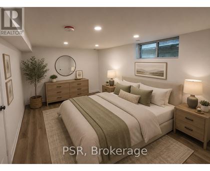 A bedroom with a bed, nightstands, and a plant.